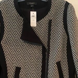 Black and white suit jacket with zipper and black leather trim